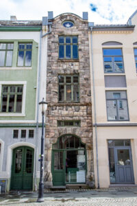 Een art-nouveaupand in Ålesund uitgevoerd in Noorse steen.
